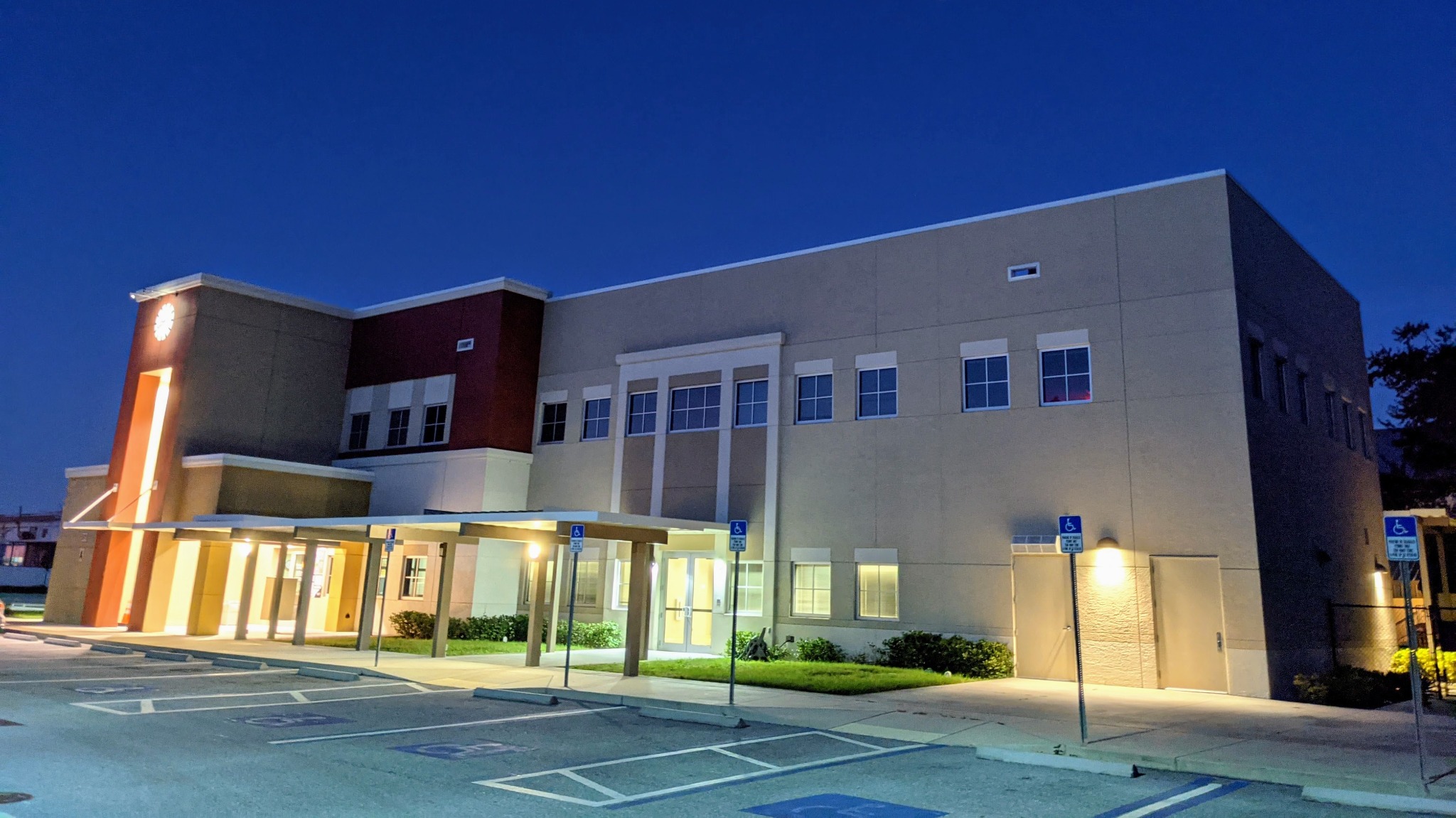 The Lealman Exchange building illuminated at dusk.